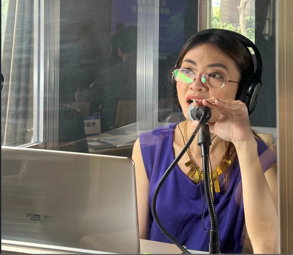 Professional interpreter working in a soundproof interpretation booth